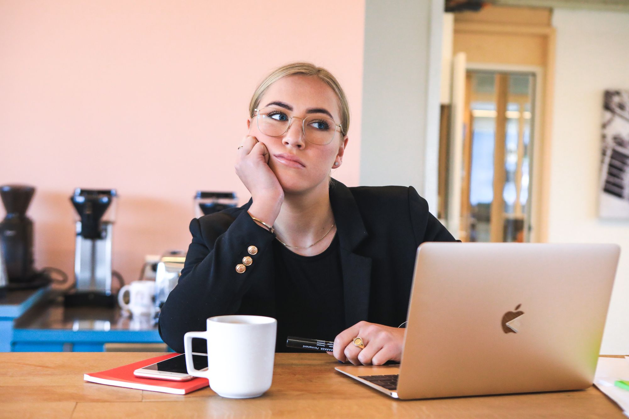 Woman thinking while working from home. Looking a bit fed up